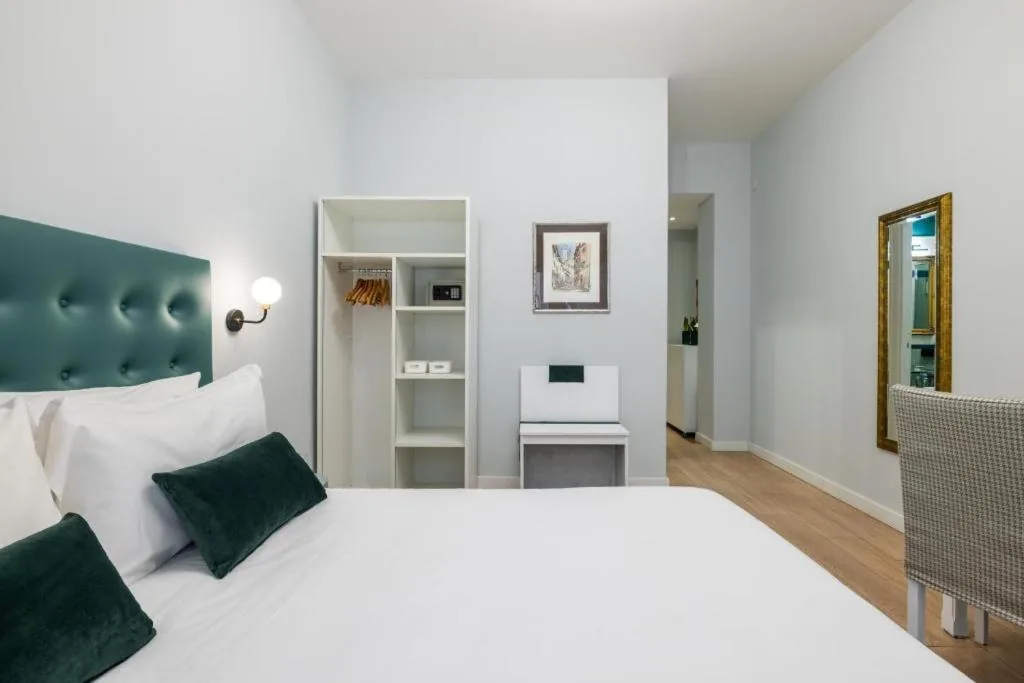 Large double bed and doorway in our Deluxe Double Room